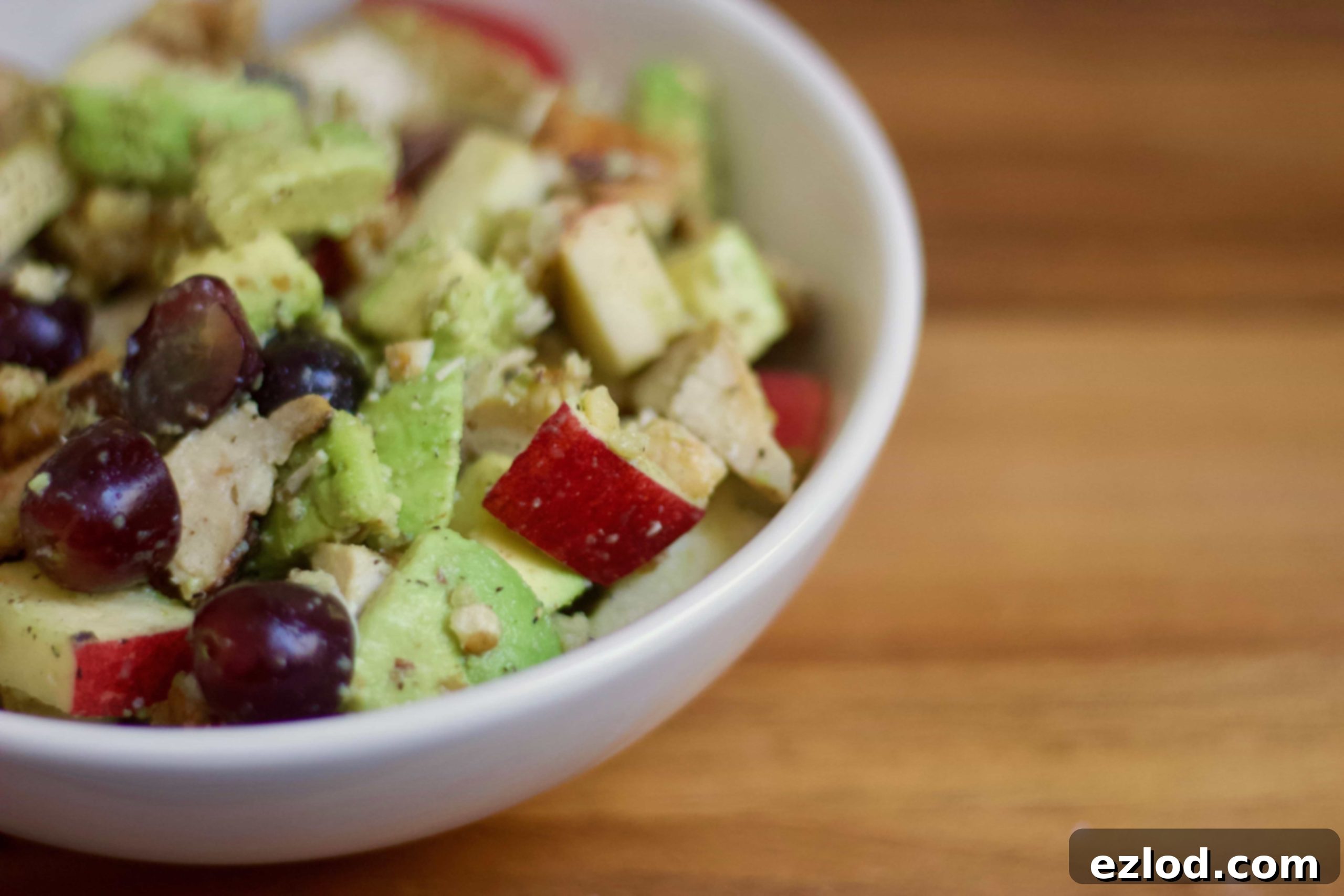 A large serving of the prepared 21 Day Fix Avocado Chicken Salad in a bowl, showcasing the fresh ingredients and vibrant colors.