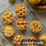 Mini apple hand pies baked in a muffin tin spiced with cardamom and cinnamon