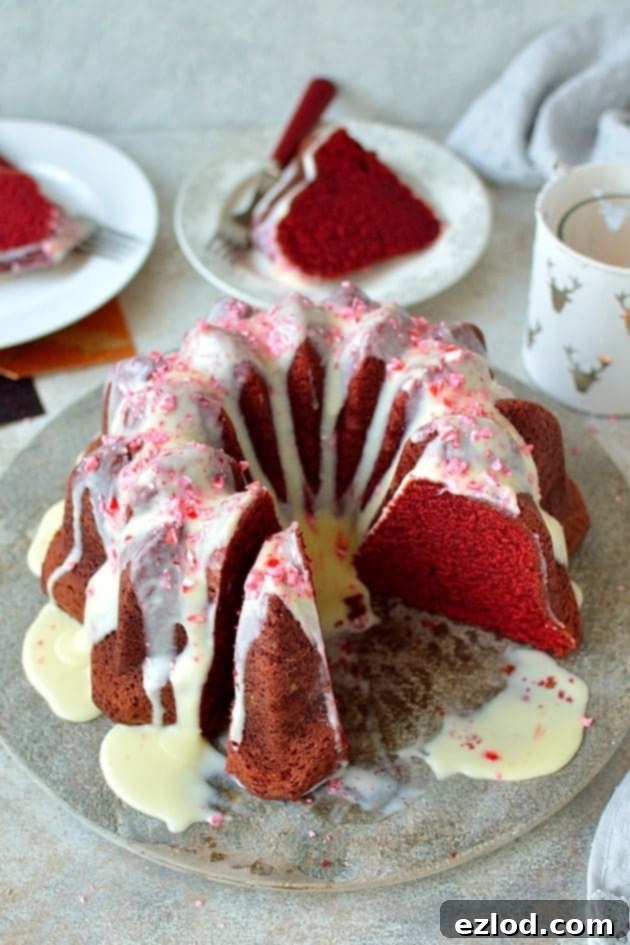 Red velvet bundt cake with white chocolate peppermint cream cheese glaze - the perfect festive cake!