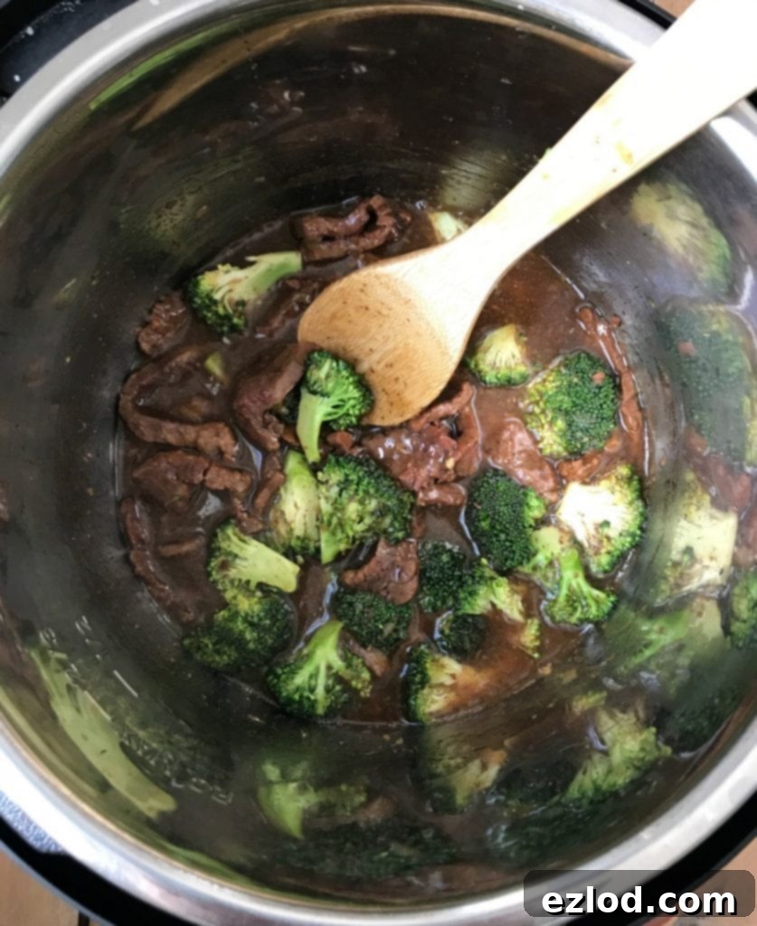 Steaming fresh broccoli florets in the Instant Pot after cooking the beef and thickening the sauce.