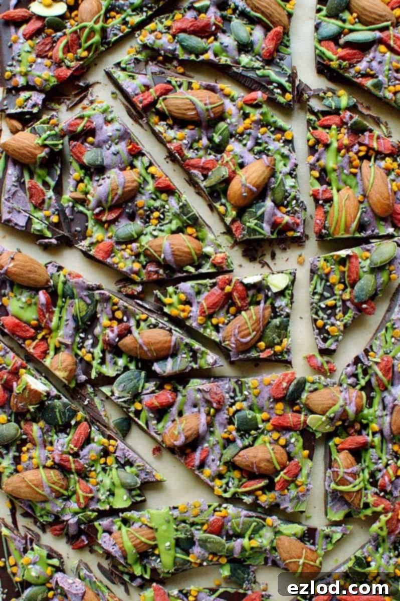 Superfood chocolate bark - dark chocolate topped with almonds, goji berries, seeds, bee pollen and white chocolate flavoured with matcha and freeze dried blueberry powder