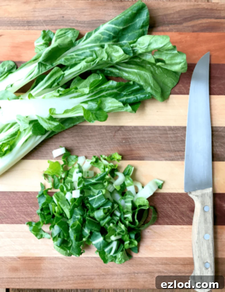 Fresh baby bok choy and shredded carrots ready to be added to the healthy Instant Pot Ramen.