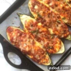 Low Carb Lasagna Stuffed Zucchini Boats with golden bubbly cheese and savory filling