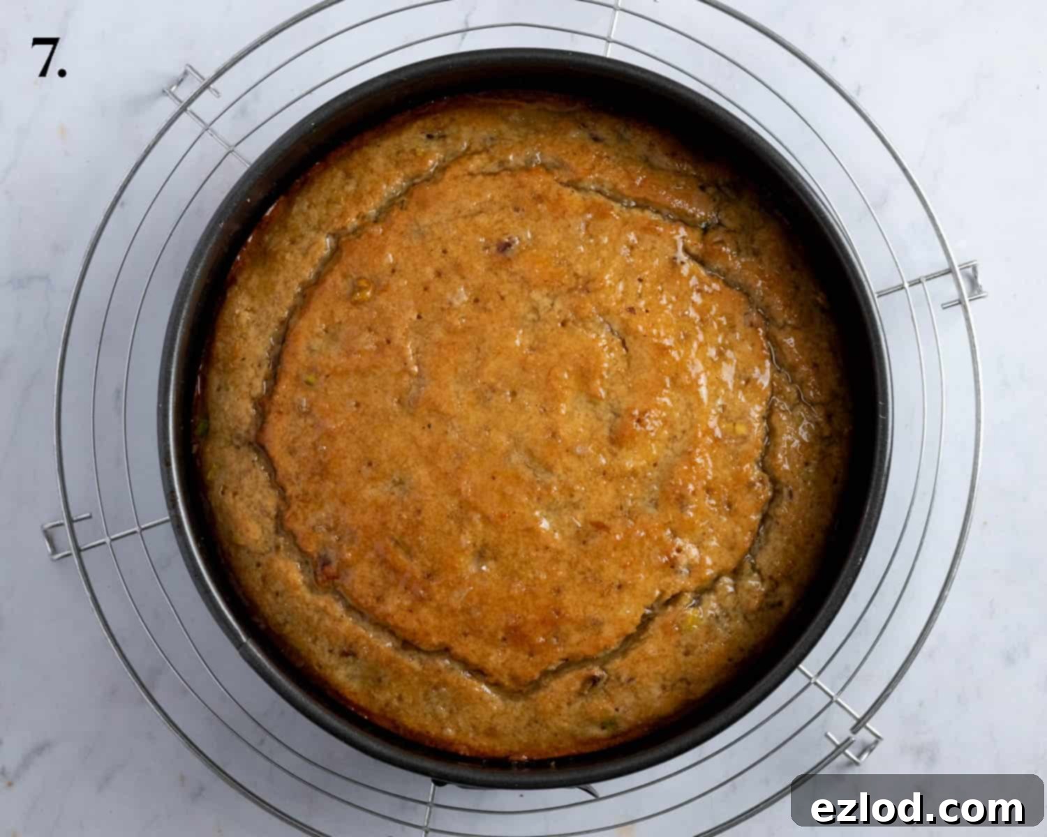 Step 7, the cake with the syrup poured over it.