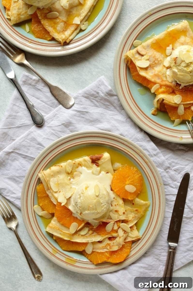 Artfully arranged crepes with caramel oranges, almond ice cream, and toasted almonds for a touch of crunch.