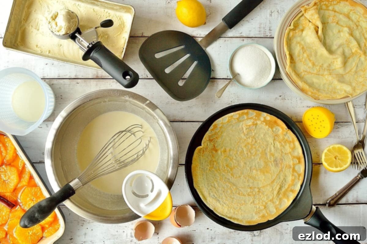 Essential OXO kitchen tools for perfect pancake making, including a mixing bowl, whisk, and pancake turner.