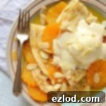 Pancakes (crepes) with caramel oranges and almond ice cream - an indulgent dessert or brunch!