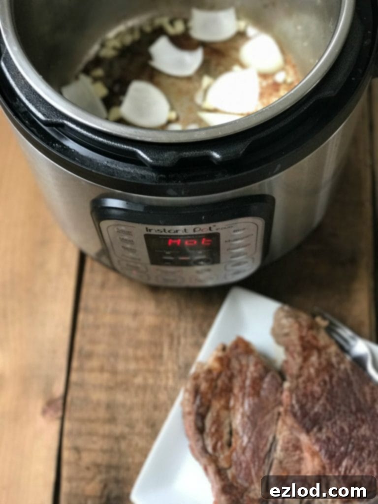 Searing a boneless chuck roast in the Instant Pot for maximum flavor