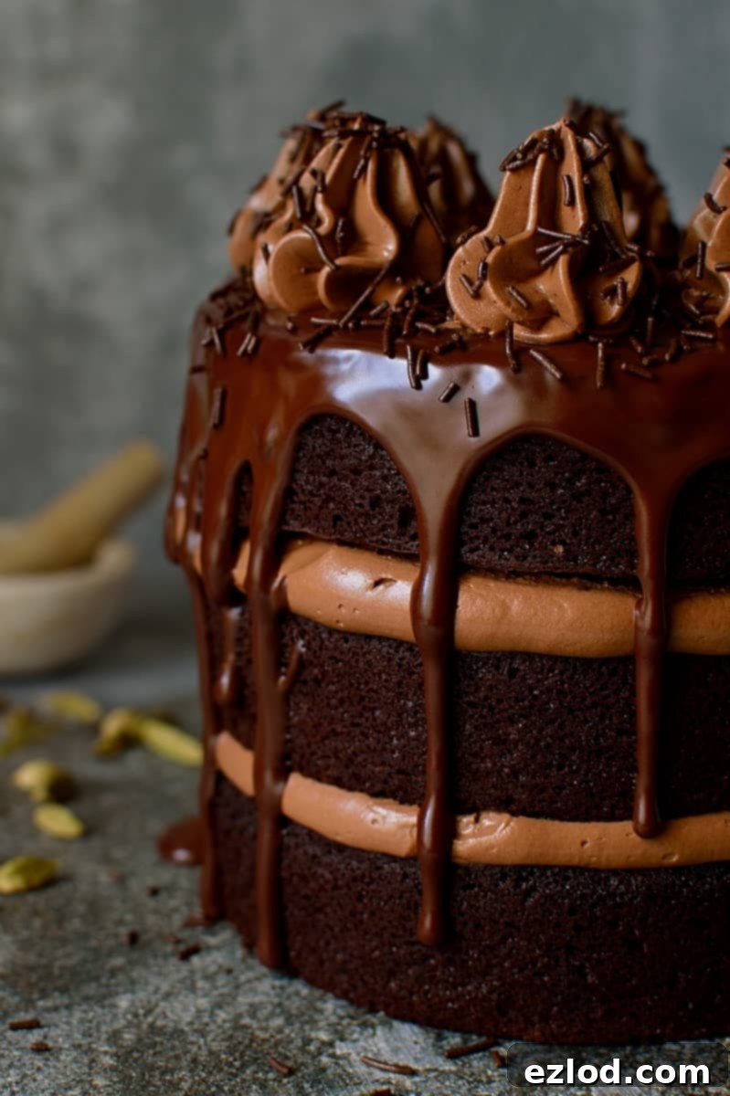 Beautifully decorated Chocolate Coffee Cardamom Layer Cake on a stand