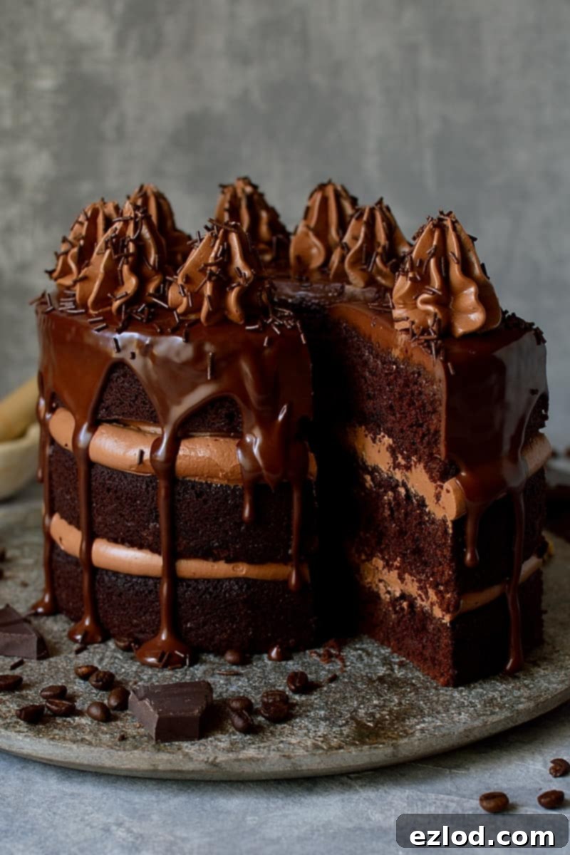 A slice of Chocolate Coffee Cardamom Layer Cake ready to be served