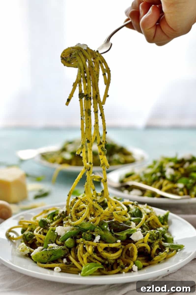 Spaghetti with lemon rocket and walnut pesto, asparagus, peas and goats cheese - quick, easy and perfect for Spring!
