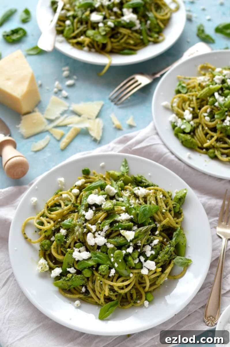 Spaghetti with lemon rocket and walnut pesto, asparagus, peas and goats cheese - quick, easy and perfect for Spring!