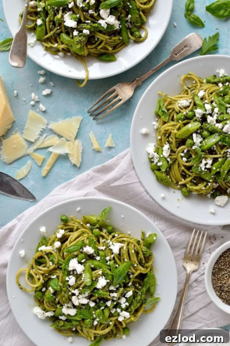 Spaghetti with lemon rocket and walnut pesto, asparagus, peas and goats cheese - quick, easy and perfect for Spring!