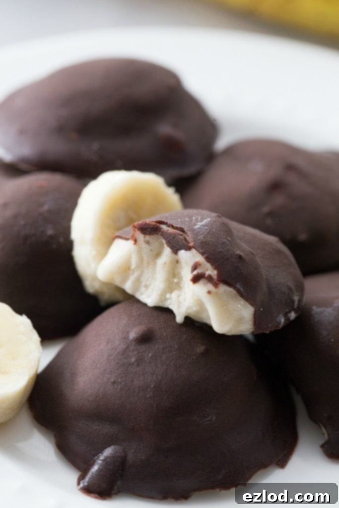 Delicious chocolate-covered 21 Day Fix banana ice cream bon bons on a white plate
