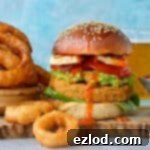 Sun-Dried Tomato Chickpea Burgers with Golden Beer-Battered Onion Rings 4 Sun-dried tomato chickpea burgers and beer battered onion rings - delicious vegetarian/vegan burgers served with the most amazing onion rings!