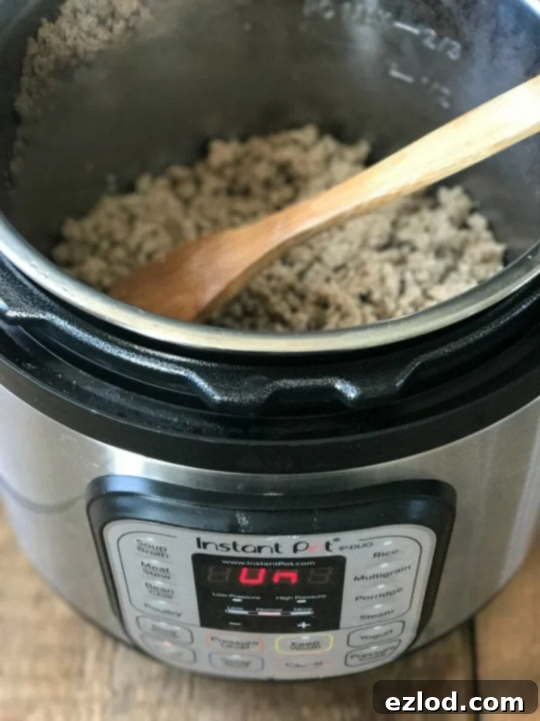 Taco meat cooling in a pan before freezing