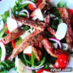 Close-up of Flank Steak with Arugula and Parmesan Cheese - a 21 Day Fix approved recipe on ConfessionsOfAFitFoodie.com