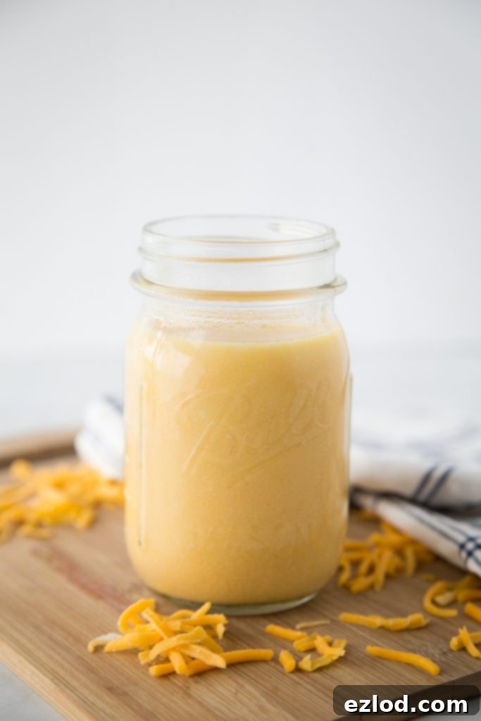 Scooping cheese sauce into silicone molds