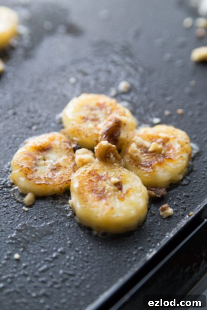 Ingredients for making healthy banana pancakes laid out on a kitchen counter, including Bob's Red Mill flour.