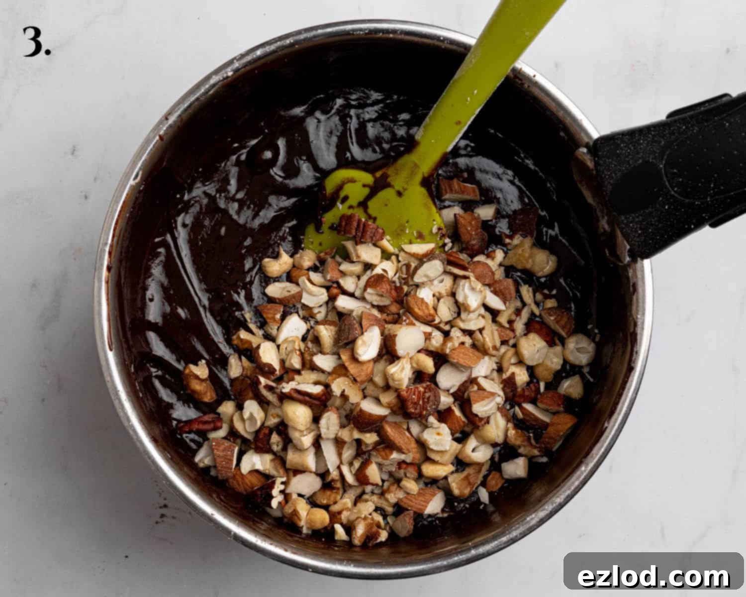 Boozy Vegan Nut Brownie Bliss 7 Step 3: The finished brownie batter, thick and rich, with chopped nuts folded in.