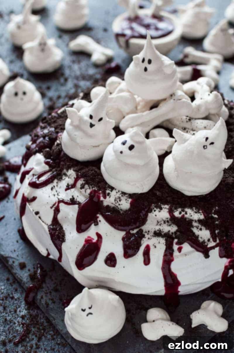 Halloween Haunted Pavlova with Meringue Ghosts and Oreo Soil