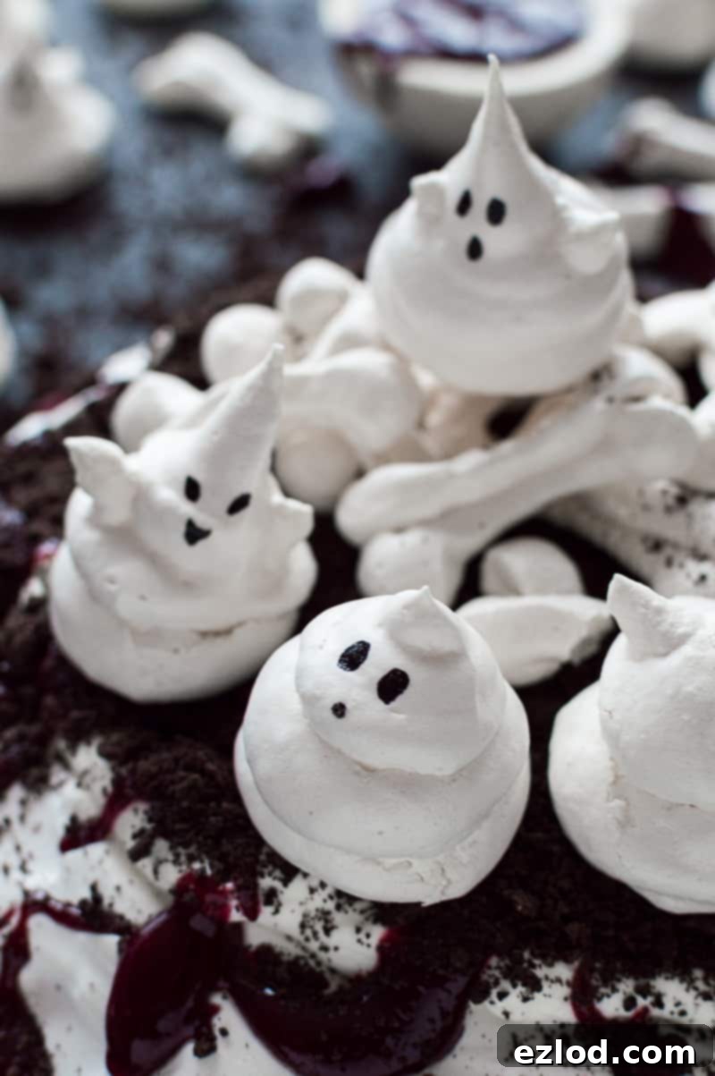 Halloween Meringue Ghosts and Bones on Pavlova