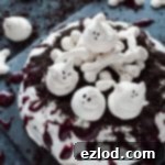 The Pavlova Poltergeist 6 Haunted Halloween pavlova - a spooky, impressive centerpiece with meringue ghosts and bones, Oreo soil and berry coulis blood; it is easier to make than you might think!