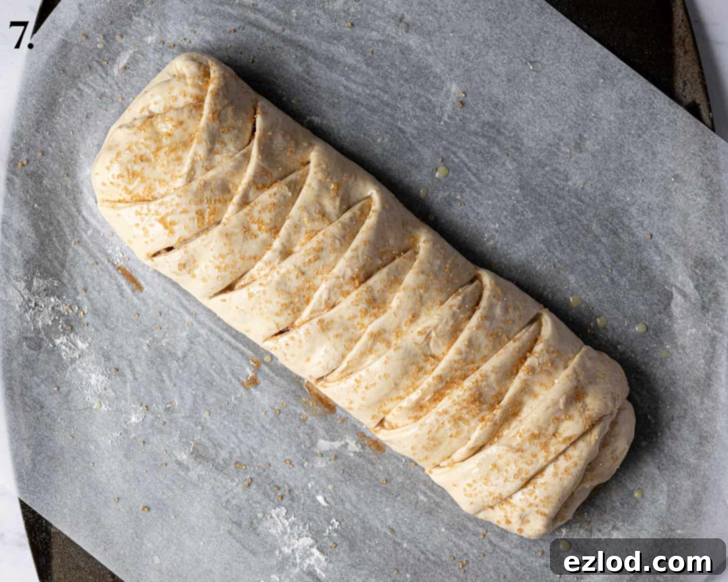 Spiced Apple Vegan Brioche 11 Step 7, the braided brioche loaf after its second rise, looking puffy and ready for baking.