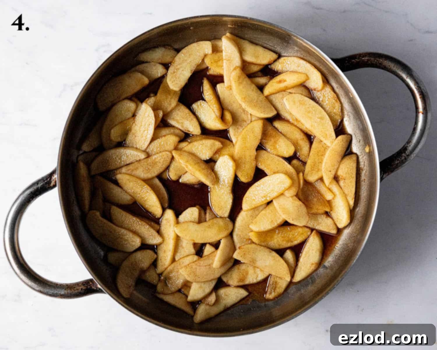 Spiced Apple Vegan Brioche 8 Step 4, a close-up image of the perfectly cooked apple filling, with softened apples and reduced syrupy juices.