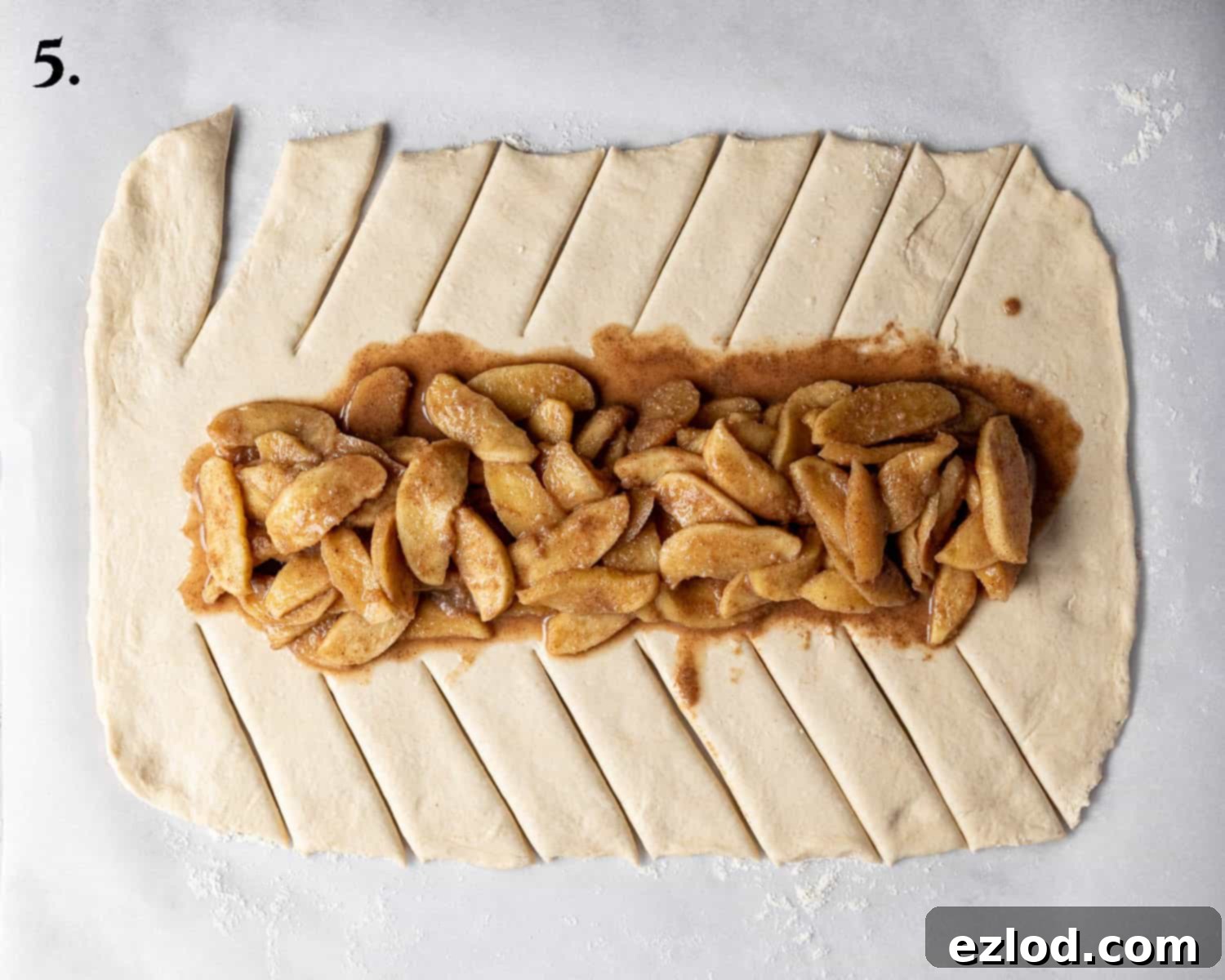 Spiced Apple Vegan Brioche 9 Step 5, the rolled out dough with the apple filling meticulously spread down the center.