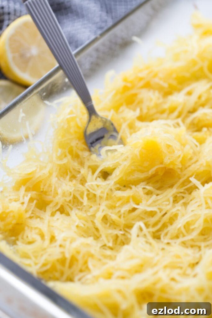 fork in a dish of squash noodles