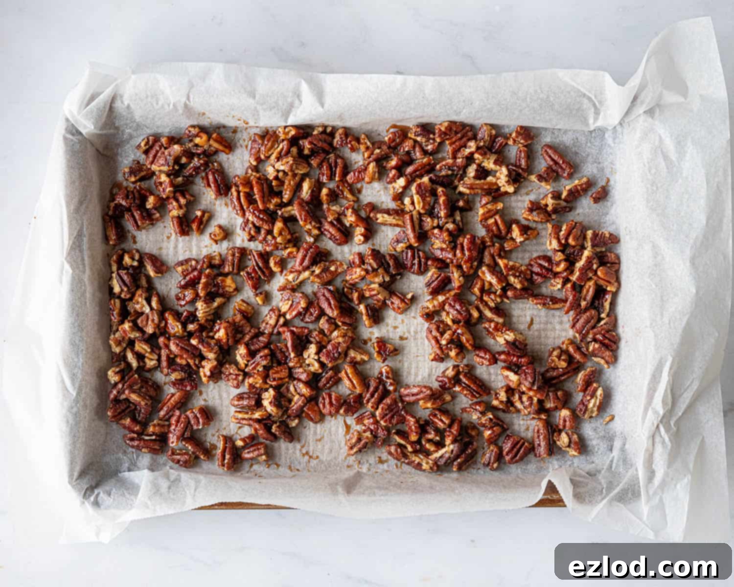 Step 4, the candied pecans on a baking sheet.