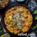 Ratatouille risotto - a creamy, flavourful vegetarian risotto filled with ratatouille vegetables, herbs, sundried tomatoes and veggie parmesan.