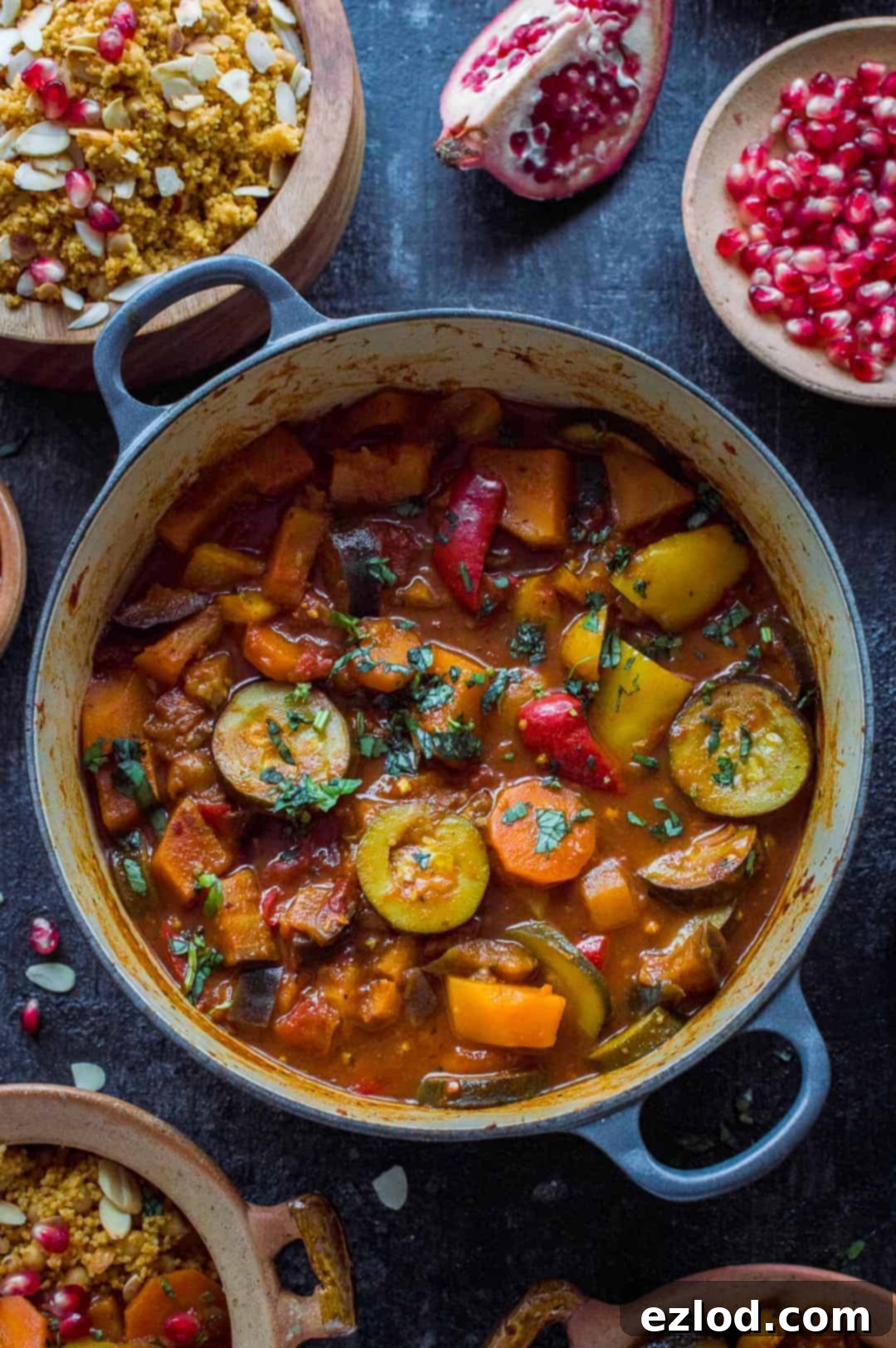 A beautifully presented vegetable tagine, rich with colourful vegetables, served alongside fluffy almond and chickpea couscous. This easy, healthy, and flavourful vegan meal is perfect for a cosy dinner.