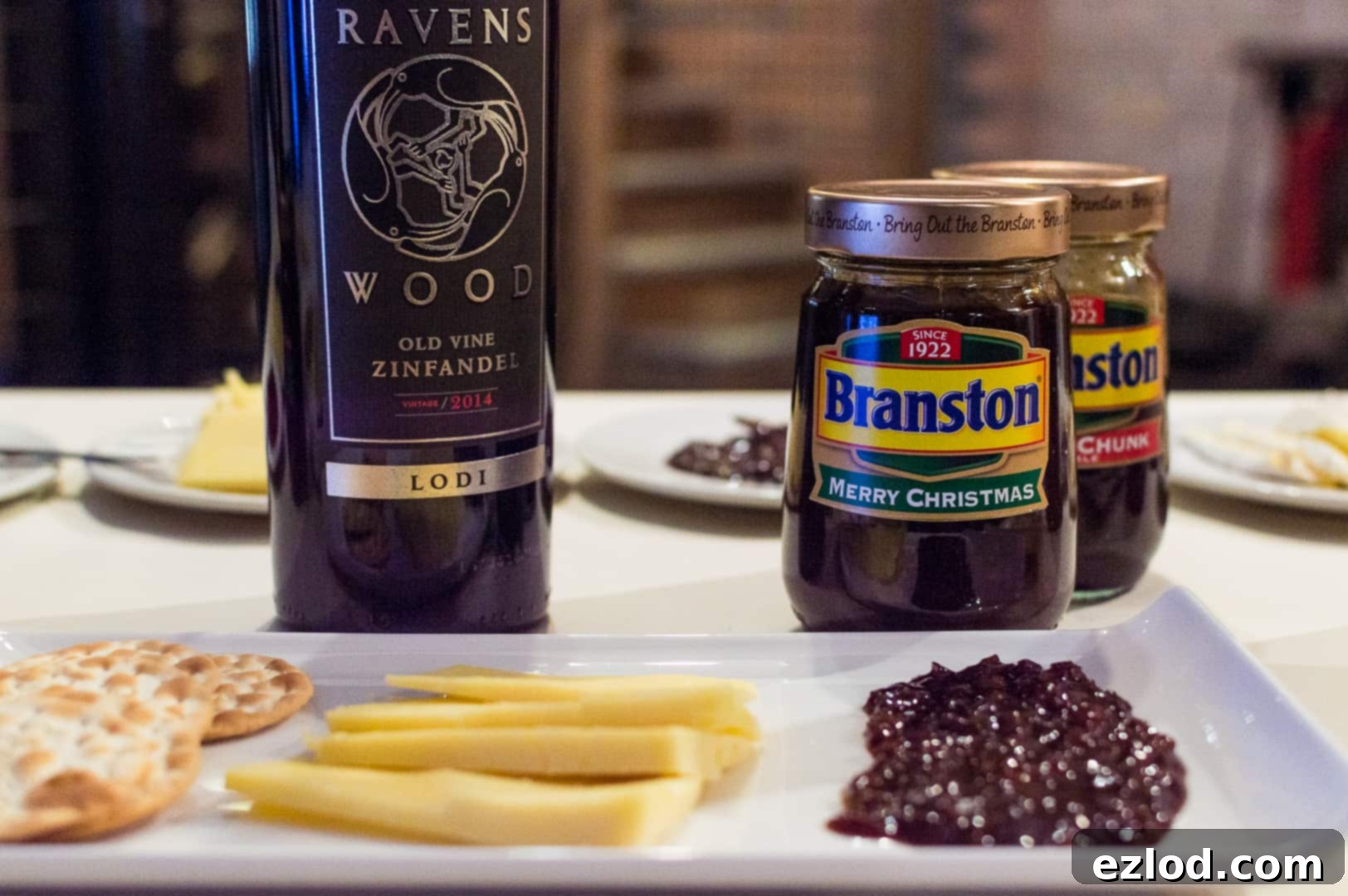 Mature cheddar cheese, a glass of Zinfandel, and a jar of Branston Small Chunk Pickle