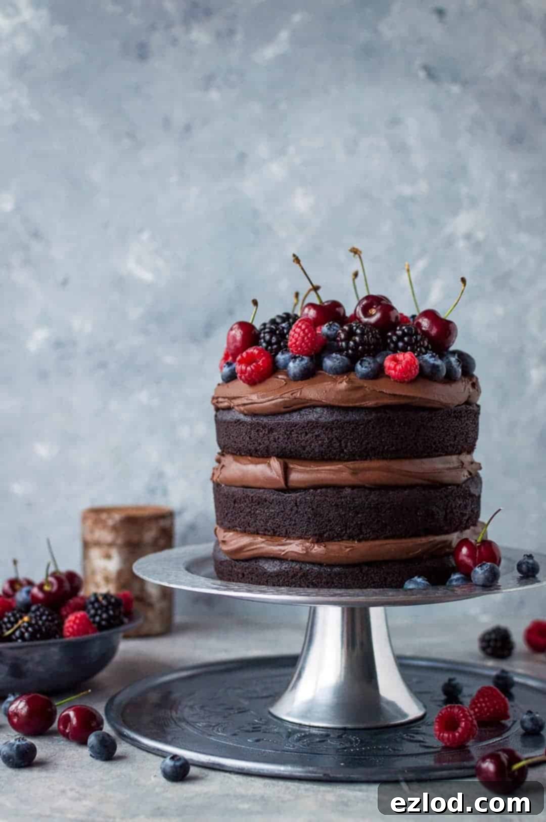 Vegan chocolate fudge cake - an easy to make, moist, fudgy vegan chocolate cake topped with coconut milk ganache. No one will be able to guess that it's vegan!