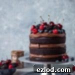 Vegan chocolate fudge cake - an easy to make, moist, fudgy vegan chocolate cake topped with coconut milk ganache. No one will be able to guess that it's vegan!