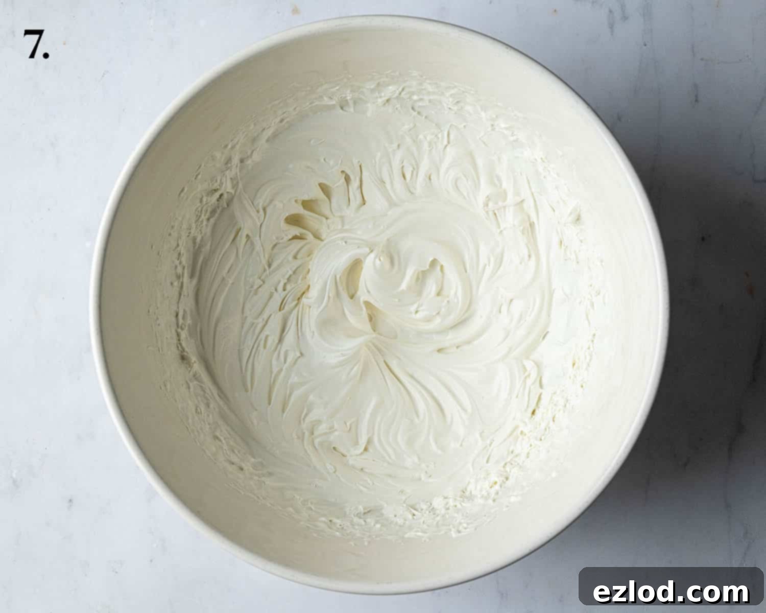 Step 7: Vegan whipping cream with sifted icing sugar, whipped to stiff peaks.