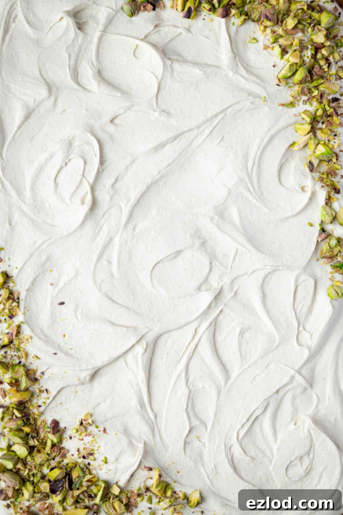 A close up of the light and airy white chocolate cream cheese whipped cream frosting.