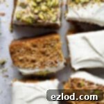 Squares of vegan carrot, pineapple and pistachio cake.