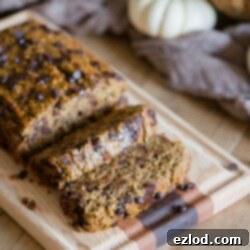 Close-up of a slice of Healthy Pumpkin Oatmeal Banana Bread with chocolate chips