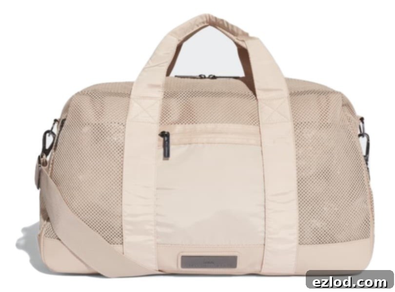 A chic adidas Women’s Yoga Bag by Stella McCartney in Rose Pearl, showcasing its spacious design.
