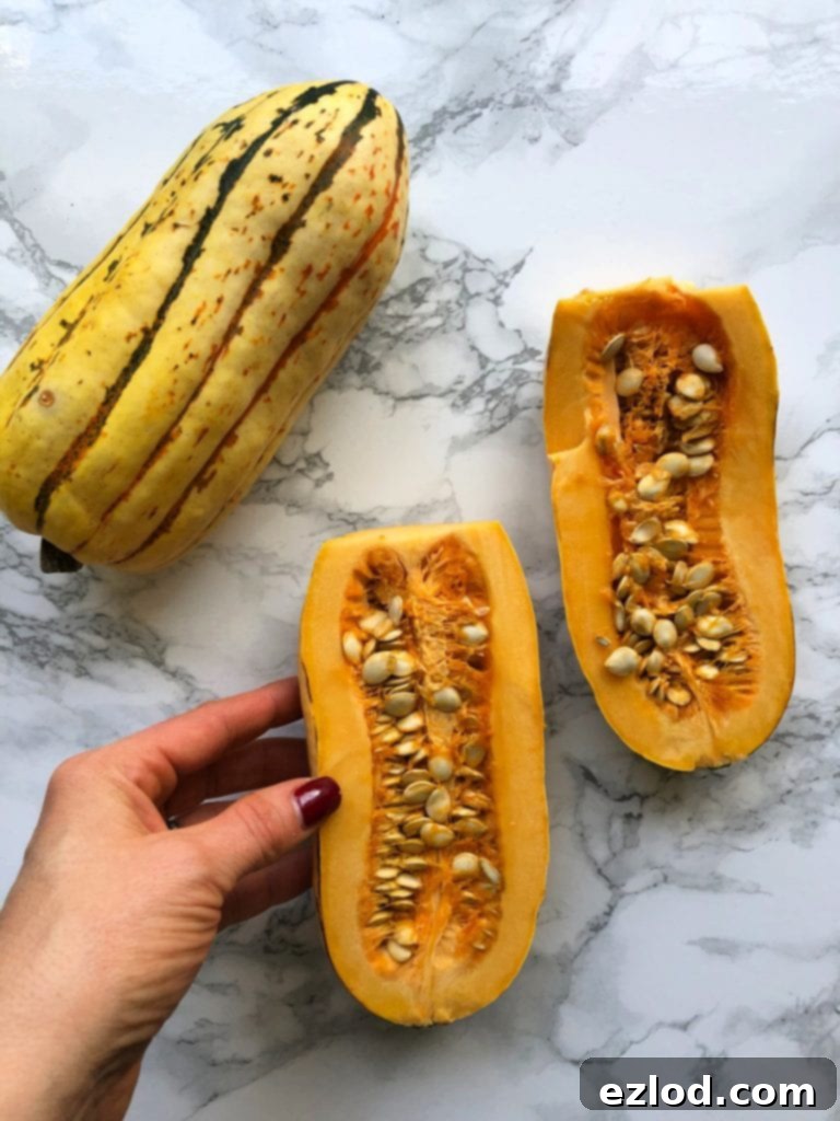 Delicata squash halves on a marble table