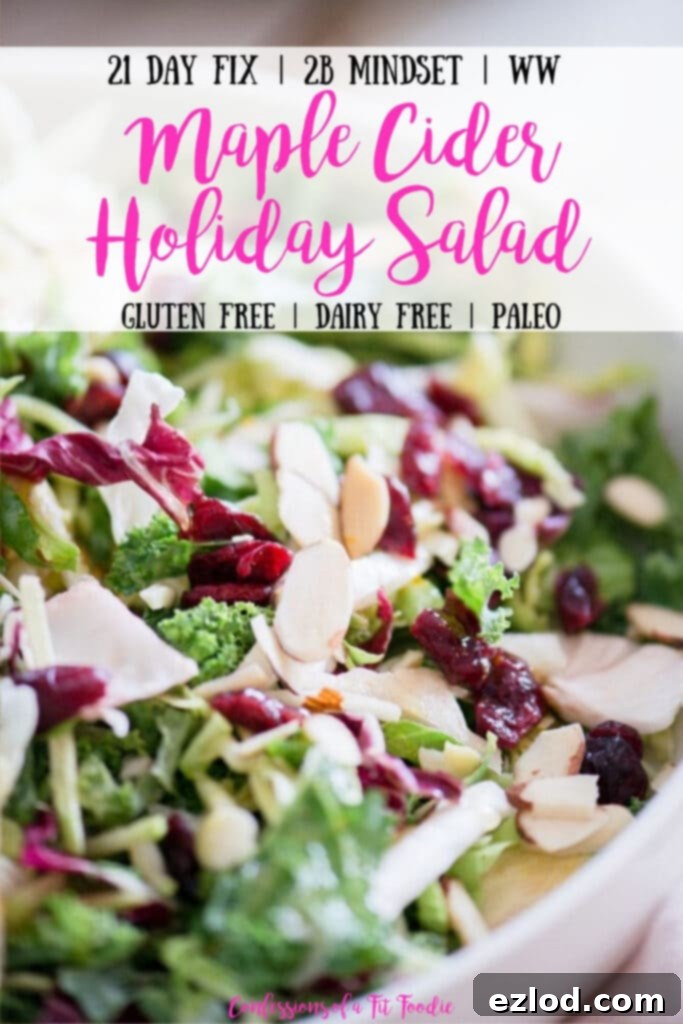 Close up of a large serving bowl of purple cabbage, shaved Brussels sprouts, broccoli slaw, kale, and topped with dried cranberries and sliced almonds. Photo has the text overlay- 21 Day Fix | 2B Mindset | WW | Maple Cider Holiday Salad | Gluten Free | Dairy Free | Paleo | Confessions of a Fit Foodie