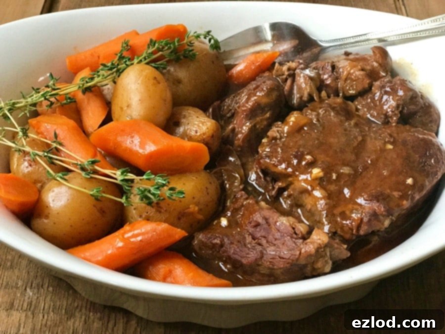 Instant Pot Beef Pot Roast with tender beef, carrots, and potatoes, a healthy 21 Day Fix meal.