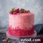 Raspberry, coconut and lemon layer cake - a gorgeous cake for Spring with coconut cake layers, raspberry buttercream and lemon curd.