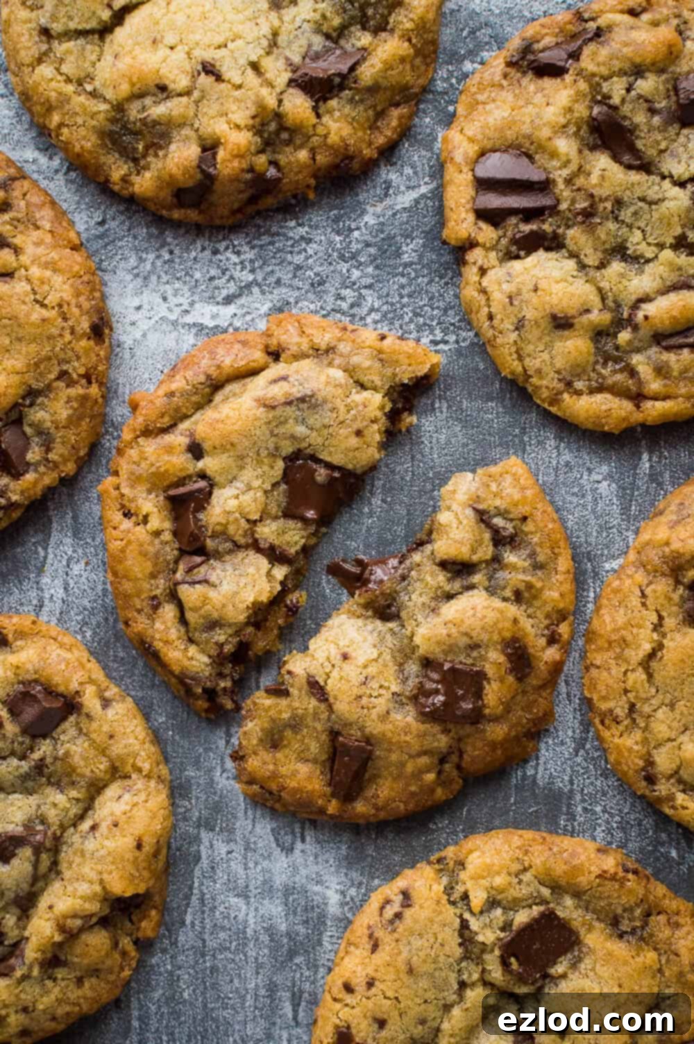 A top down photo of a broken in half egg and dairy free vegan chocolate chip cookie.