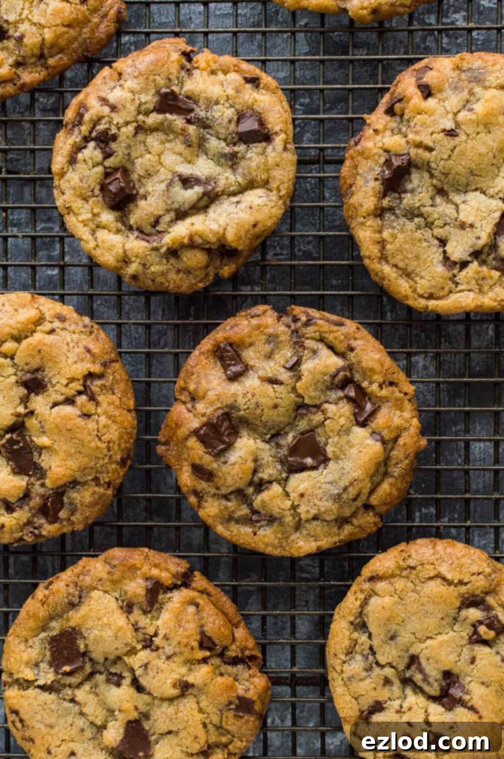 Top down photo of egg and dairy free vegan chocolate chip cookies on a wire cooling rack.