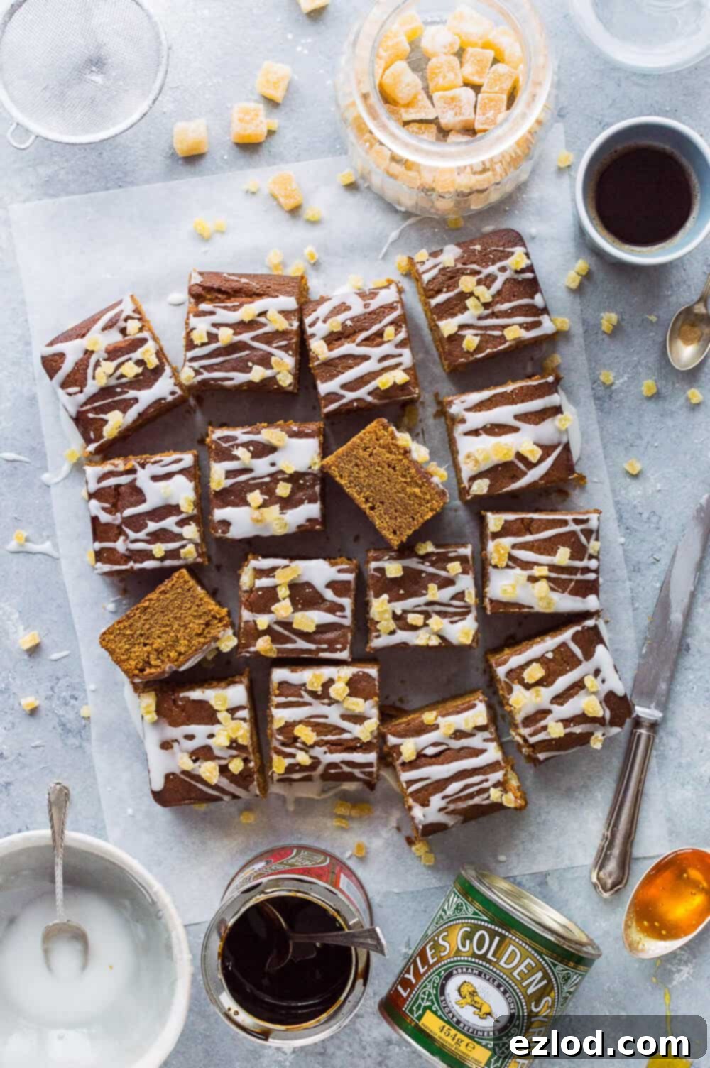 Close-up of vegan egg and dairy-free ginger snack cake, enriched with golden syrup and treacle, cut into inviting squares.