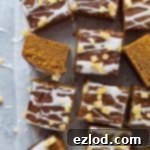 Vegan ginger sheet cake with lemon glaze and crystallised ginger sliced into squares.